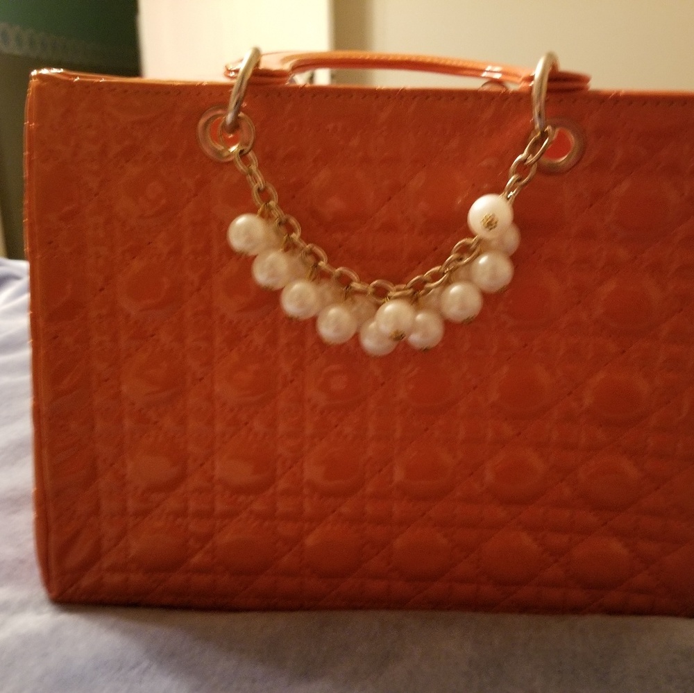 XLM orange vinyl handbag